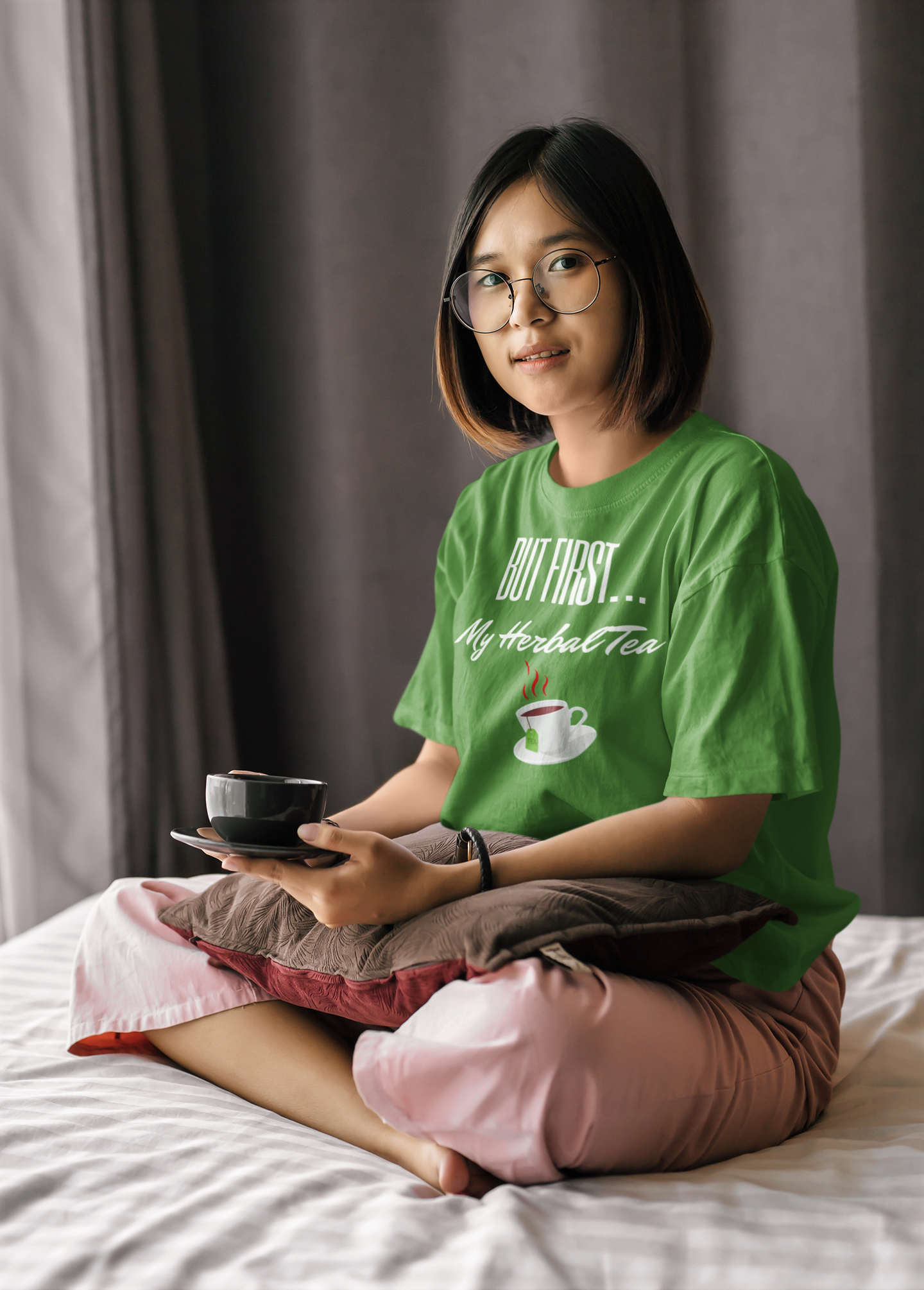 oversize-t-shirt-mockup-of-a-woman-with-glasses-having-tea-on-her-bed-m4668-r-el2.png
